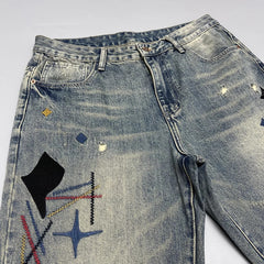 Washed Scraping Denim Patch Embroidered Printed Jeans